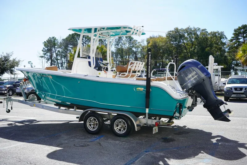 Slide: The Image of 2021 Sea Hunt Ultra 219 boat on trailer with Yamaha outboard motor. - 24