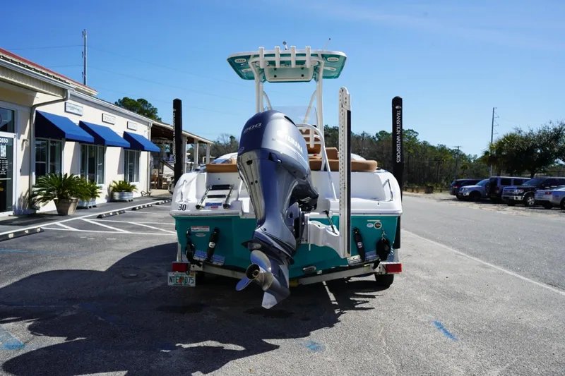 Slide: The Image of 2021 Sea Hunt Ultra 219 boat with Yamaha outboard motor in parking lot. - 26