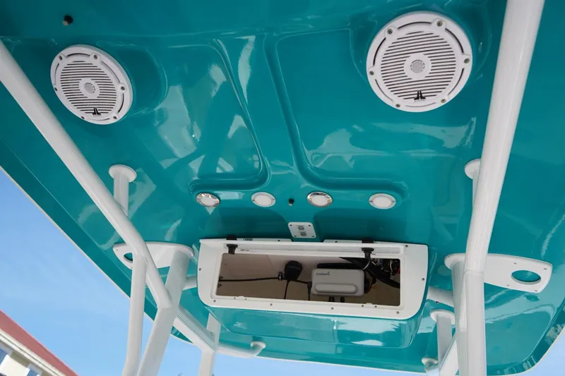 Slide: The Image of 2021 Sea Hunt Ultra 219 boat interior with speakers and storage compartment. - 35