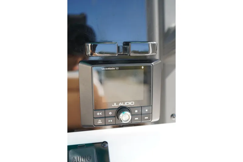 Slide: The Image of JL Audio MediaMaster 50 on 2021 Sea Hunt Ultra 219 boat dashboard. - 38