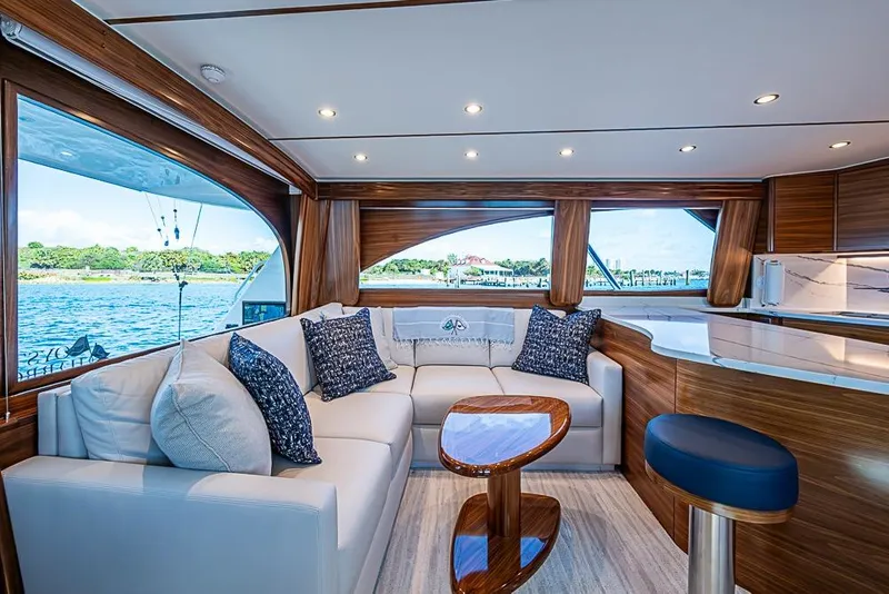 Slide: The Image of Luxurious interior of 2026 Viking 54 Convertible yacht with elegant seating and scenic ocean view. - 29