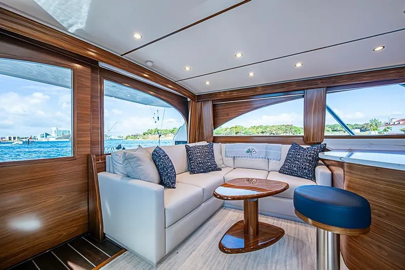Slide: The Image of Luxurious interior of 2026 Viking 54 Convertible yacht with elegant seating and scenic views. - 30