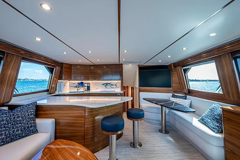 Slide: The Image of Luxurious interior of 2026 Viking 54 Convertible yacht with modern design and ocean views. - 31