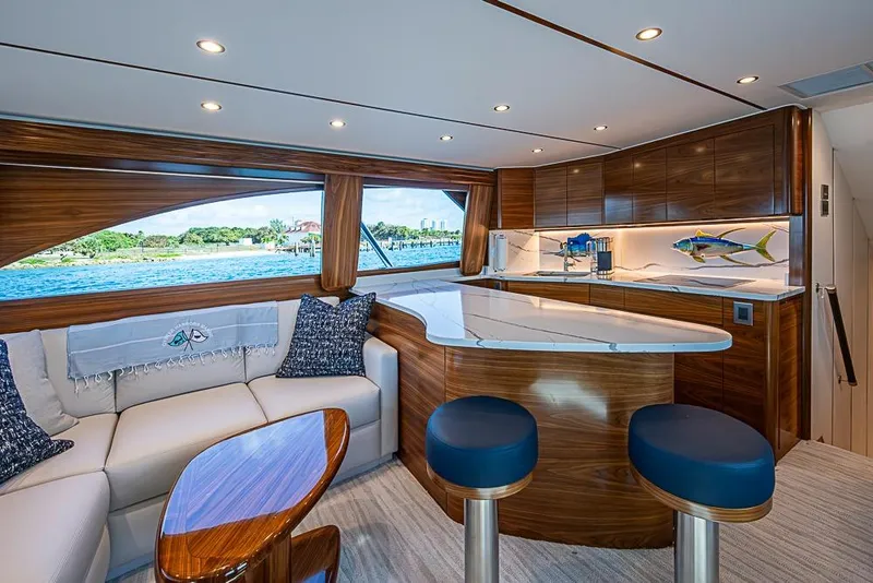 Slide: The Image of Luxurious interior of 2026 Viking 54 Convertible yacht with elegant wood finishes and modern design. - 32