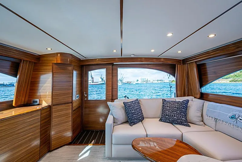 Slide: The Image of Luxurious interior of 2026 Viking 54 Convertible yacht with elegant wood finish and waterfront view. - 35