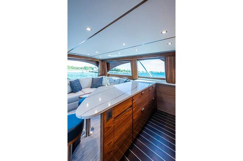 Slide: The Image of Luxurious interior of 2026 Viking 54 Convertible yacht with elegant wood finishes and ocean view. - 38