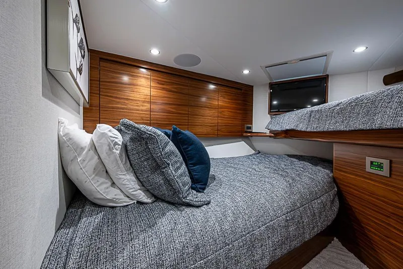 Slide: The Image of Luxurious cabin interior of 2026 Viking 54 Convertible yacht with cozy bedding and modern design. - 44