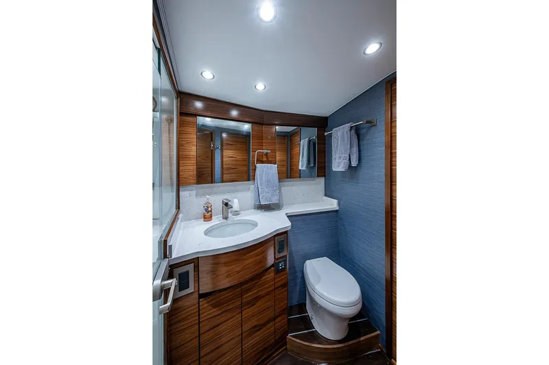 Slide: The Image of Luxurious bathroom in 2026 Viking 54 Convertible yacht with modern fixtures and elegant wood finishes. - 50