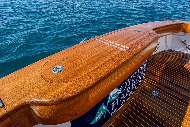 Slide: The Image of Luxurious 2026 Viking 54 Convertible yacht with polished wooden deck and ocean view. - 6