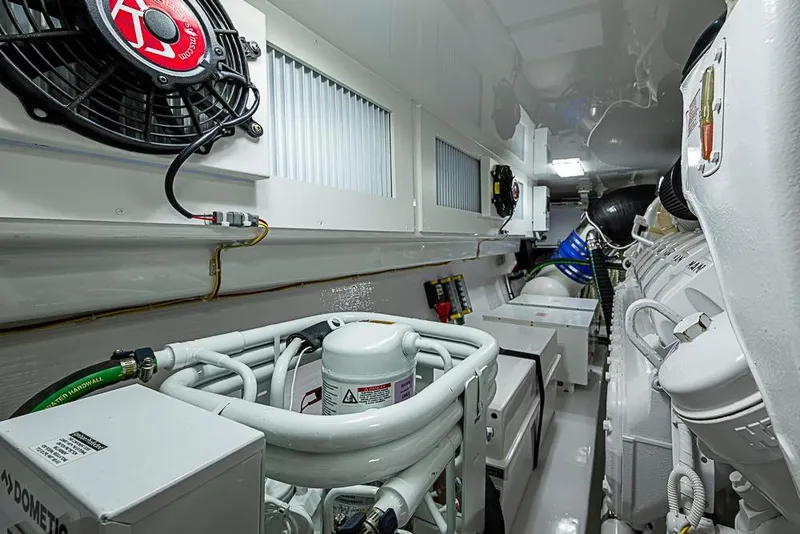 Slide: The Image of Engine room of 2026 Viking 54 Convertible yacht, showcasing advanced machinery and equipment. - 60