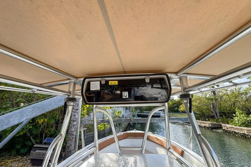 Slide: The Image of 2005 Sailfish 2660 CC boat interior with canopy and storage compartment. - 37