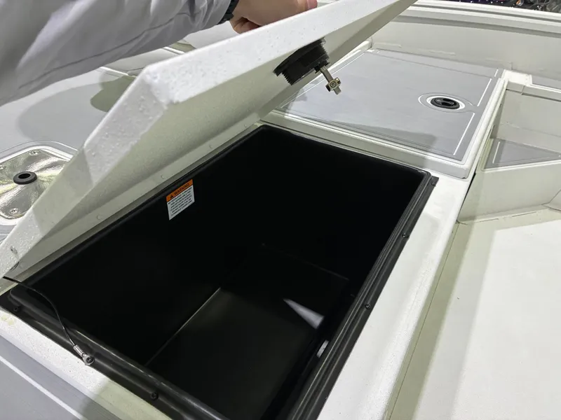 Slide: The Image of Open storage compartment on a 2026 G3 Bay 20 boat. - 12