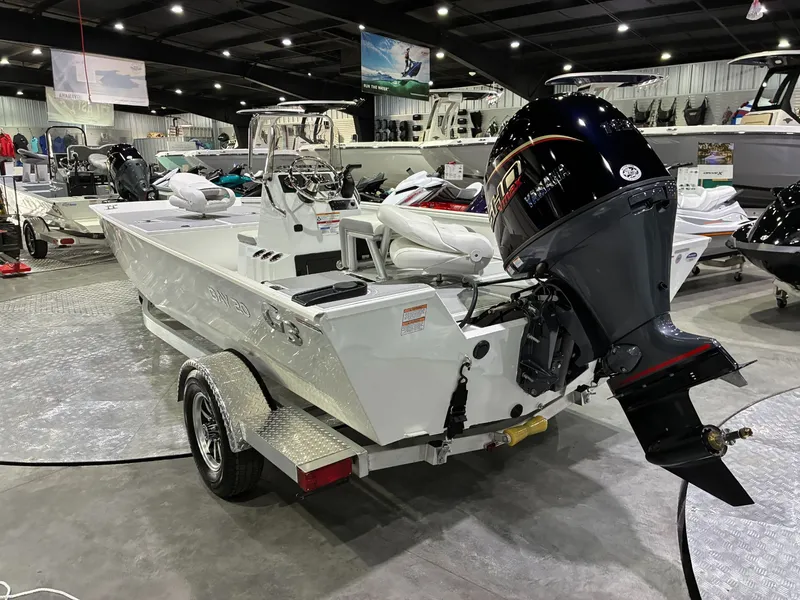 Slide: The Image of G3 Bay 20 boat 2026 on trailer in a showroom. - 3