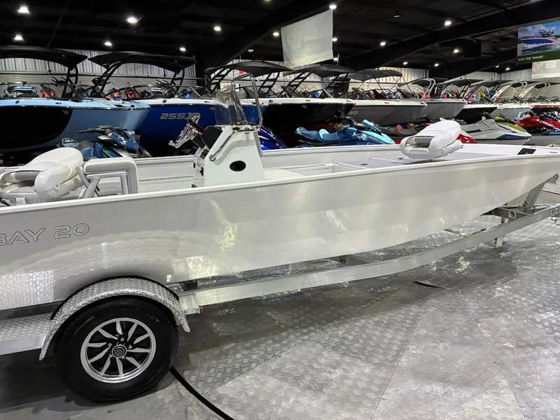 Slide: The Image of 2026 G3 Bay 20 boat on a trailer in a showroom. - 6