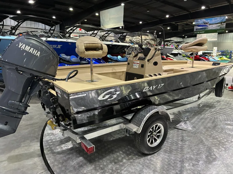 Slide: The Image of 2026 G3 Bay 17 boat with Yamaha engine in a showroom. - 5