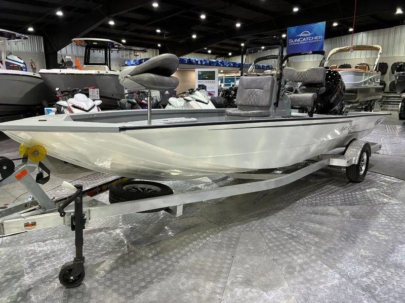 The Image of G3 Bay 21 GX 2026 boat on trailer in showroom. - 1