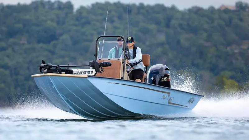 Slide: The Image of 2026 G3 Bay 21 GX boat cruising on water. - 26