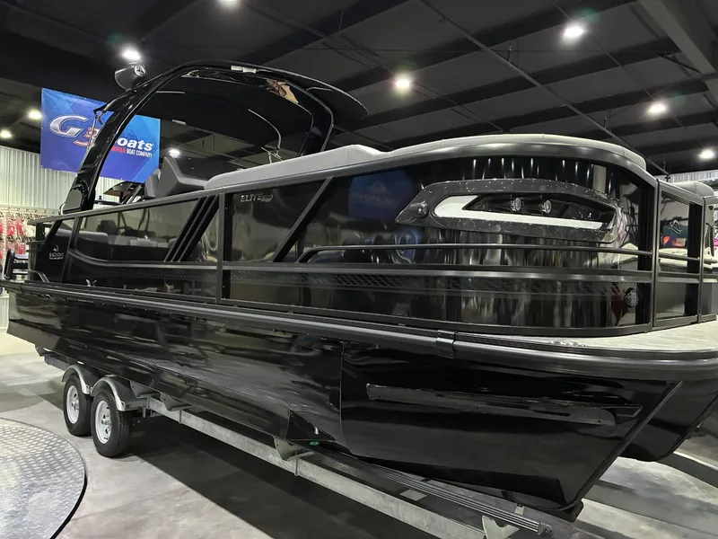 The Image of 2026 SunCatcher Elite 326 SL pontoon boat in a showroom. - 1