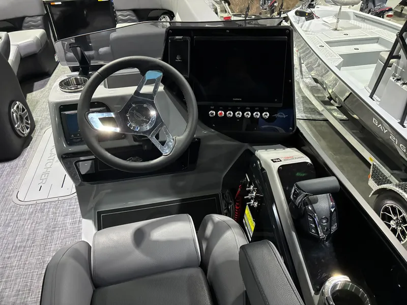 Slide: The Image of Interior of 2026 SunCatcher Elite 326 SL with modern helm console. - 11