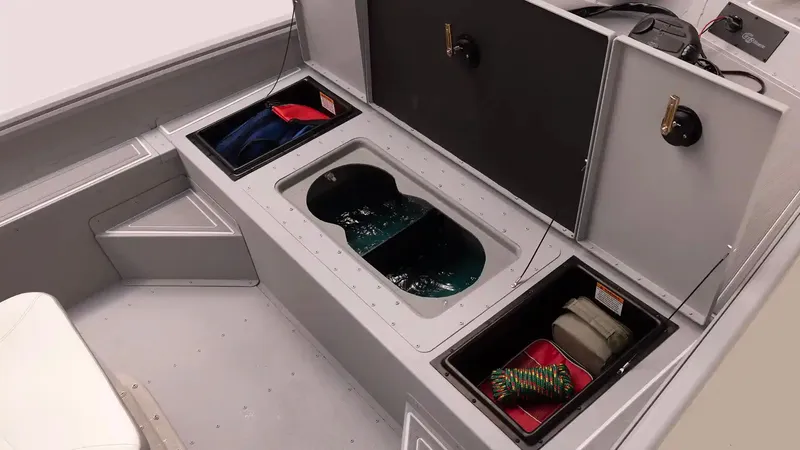 Slide: The Image of Interior view of 2026 G3 Bay 17 boat model with storage compartments. - 17