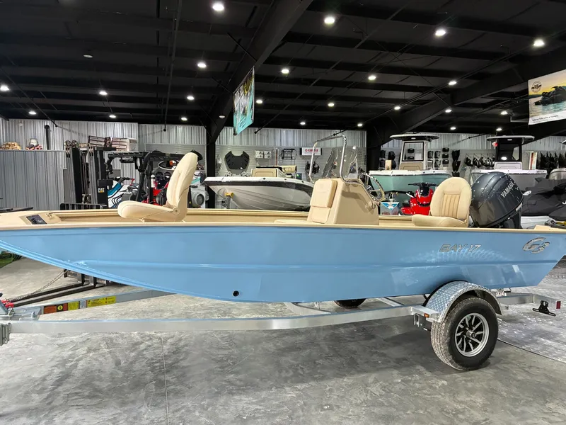 Slide: The Image of 2026 G3 Bay 17 boat displayed in showroom. - 2