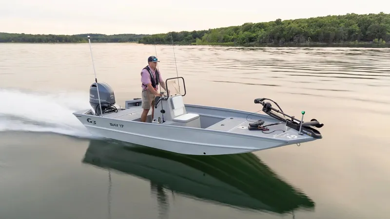 Slide: The Image of G3 Bay 17 boat 2026 on calm lake with driver. - 25