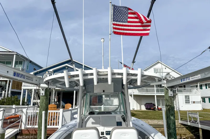 Slide: The Image of 2021 Cape Horn 31 T boat docked, featuring sleek design and spacious seating. - 20