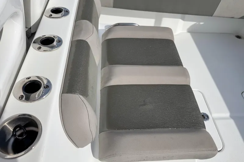 Slide: The Image of 2021 Cape Horn 31 T boat seating with rod holders, gray and white upholstery. - 16