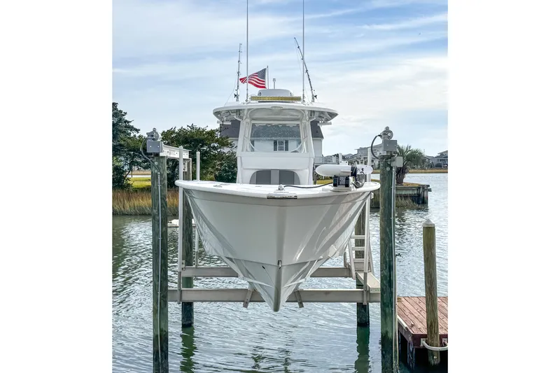 Slide: The Image of 2021 Cape Horn 31 T boat docked, featuring sleek design and modern equipment. - 2