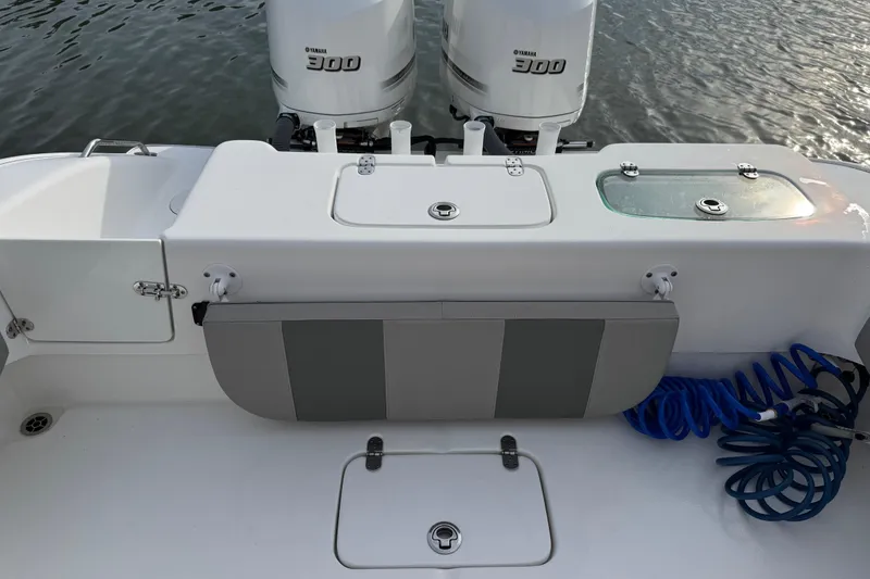 Slide: The Image of Cape Horn 31 T boat with Yamaha engine docked by waterfront homes, 2021 model. - 6