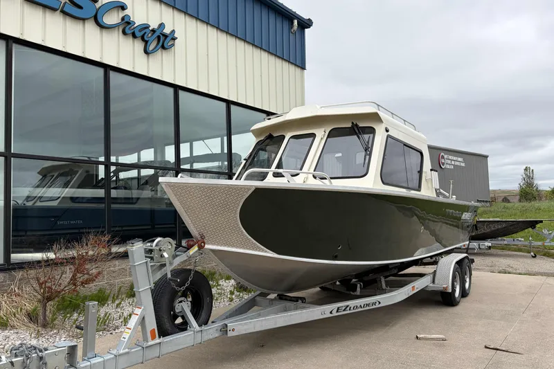 Slide: The Image of 2026 Hewescraft 240 Ocean Pro ET Hardtop boat on trailer outside dealership. - 3