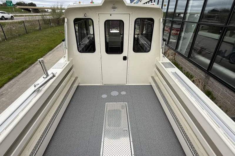 Slide: The Image of 2026 Hewescraft 240 Ocean Pro ET Hardtop boat deck, featuring spacious layout and durable flooring. - 4
