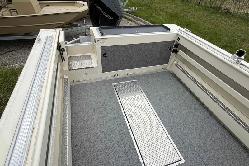 Slide: The Image of 2026 Hewescraft 240 Ocean Pro ET Hardtop boat interior with storage and non-slip flooring. - 6