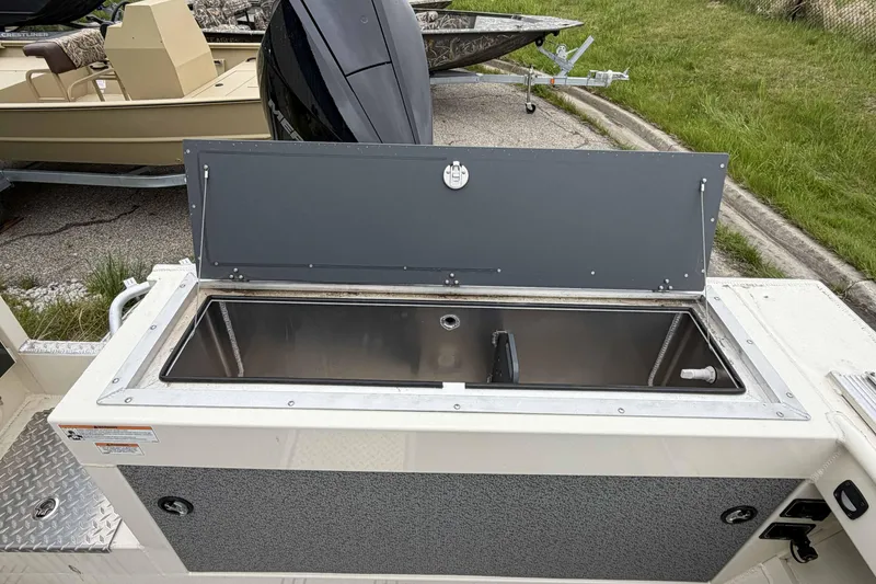 Slide: The Image of Open storage compartment on 2026 Hewescraft 240 Ocean Pro ET Hardtop boat. - 7