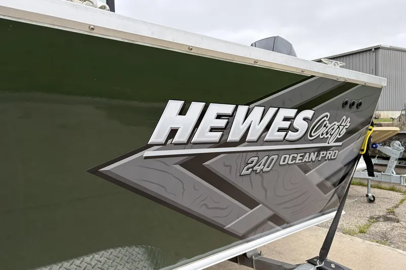 Slide: The Image of 2026 Hewescraft 240 Ocean Pro ET Hardtop boat with sleek design and bold branding. - 9