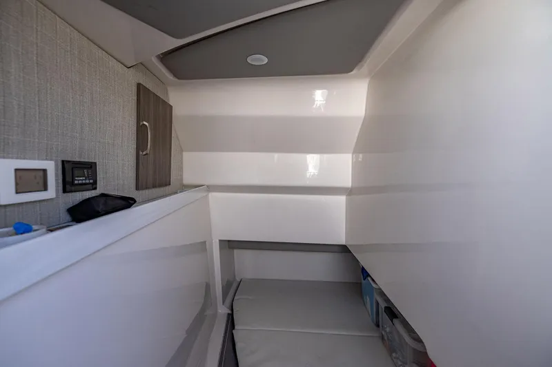 Slide: The Image of 2022 Regal LX36 cabin interior with modern design and storage space. - 18