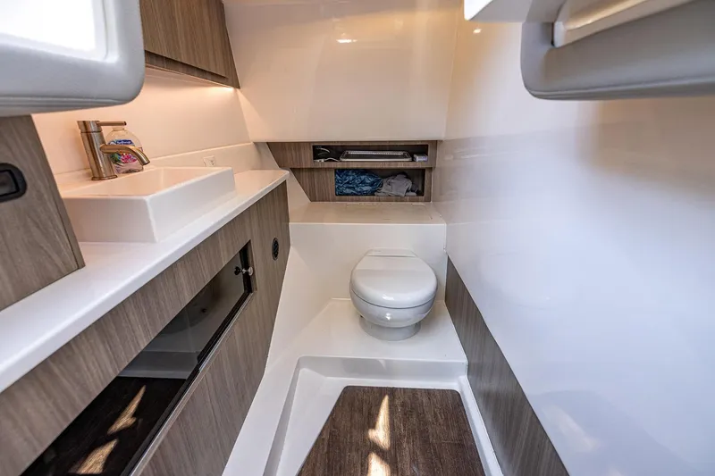 Slide: The Image of Luxurious bathroom interior of 2022 Regal LX36 yacht with modern fixtures and wood accents. - 21