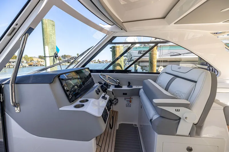 Slide: The Image of 2022 Regal LX36 boat interior with modern helm and luxurious seating. - 25