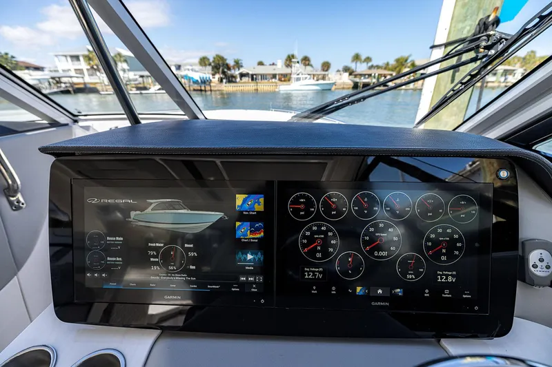 Slide: The Image of 2022 Regal LX36 dashboard with digital displays and navigation controls. - 30