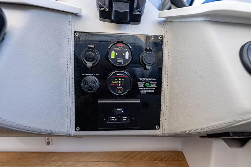 Slide: The Image of Control panel of 2022 Regal LX36 boat with safety and power features. - 32
