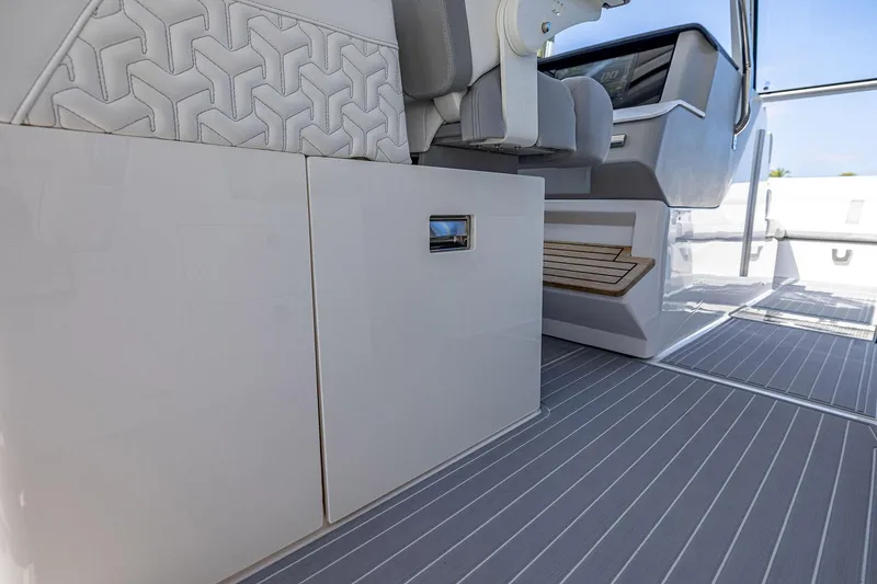 Slide: The Image of 2022 Regal LX36 boat interior with sleek seating and modern dashboard design. - 39
