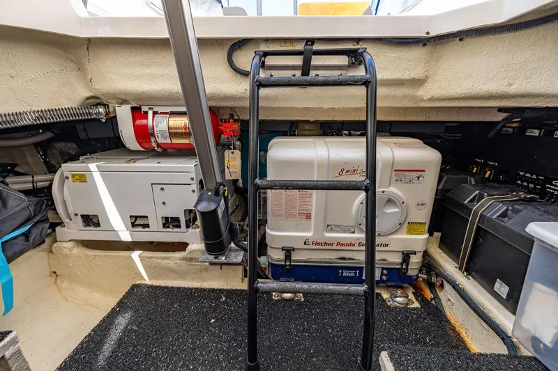 Slide: The Image of Engine room of 2022 Regal LX36 with Fischer Panda generator and fire extinguisher. - 51