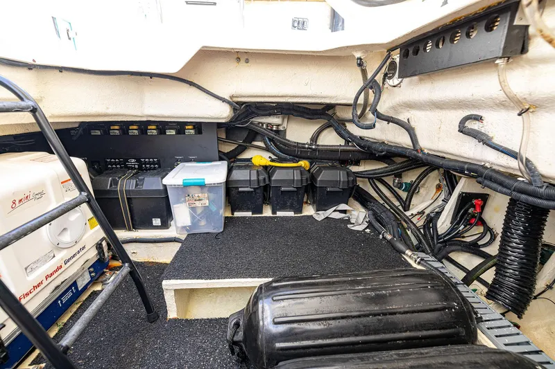 Slide: The Image of Engine room of 2022 Regal LX36 boat with generator and wiring. - 53