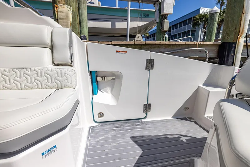Slide: The Image of 2022 Regal LX36 boat interior with white seating and modern design elements. - 55