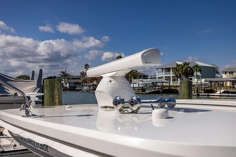 Slide: The Image of 2022 Regal LX36 boat radar system with waterfront view and clear skies. - 60
