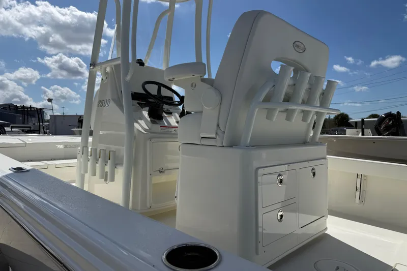 Slide: The Image of 2026 Pathfinder 2500 Hybrid boat interior with steering console and storage compartments. - 10