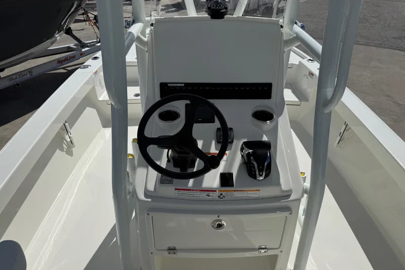 Slide: The Image of 2026 Pathfinder 2500 Hybrid boat console with steering wheel and controls. - 12