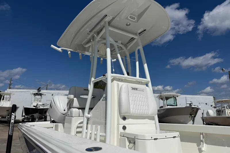 Slide: The Image of 2026 Pathfinder 2500 Hybrid boat with T-top under a clear blue sky. - 3