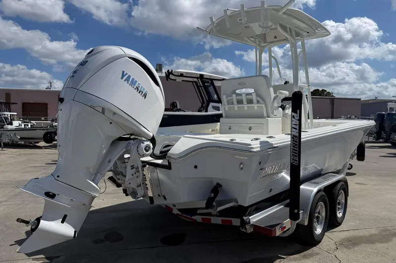 Slide: The Image of 2026 Pathfinder 2500 Hybrid boat with Yamaha engine on trailer, under a sunny sky. - 7