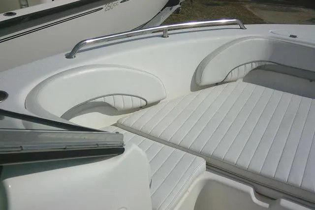 Slide: The Image of Tidewater 196 DC Explorer 2011 boat interior with white cushioned seating. - 10